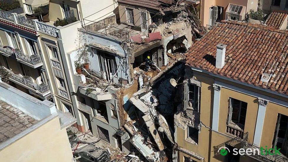 One dead and five missing after explosion destroys building close to Acropolis in Athens