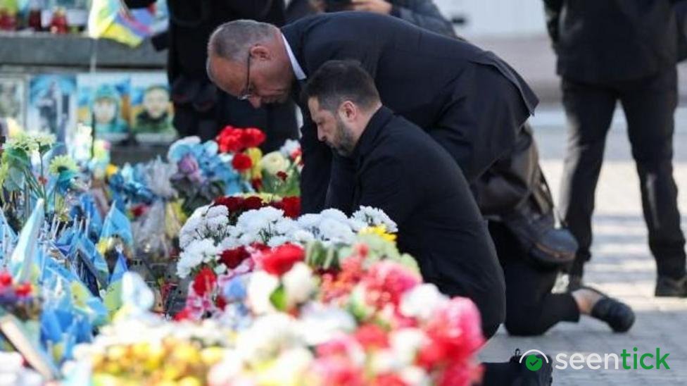 Kyiv bridge hit in further Russian drone attack as German chancellor makes surprise visit